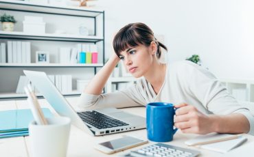 tired-woman-at-office-desk